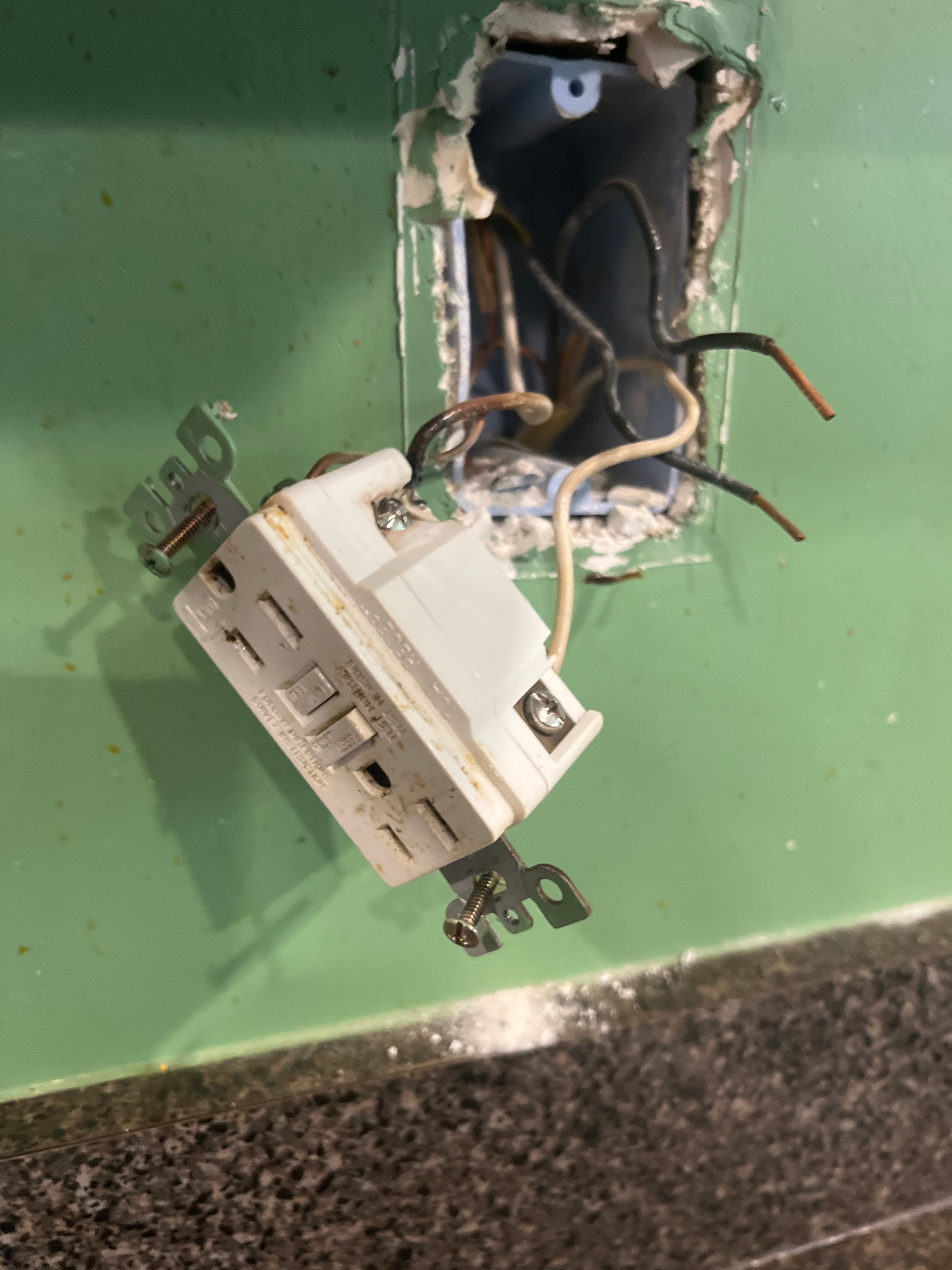 Light switch panel with two new switches installed